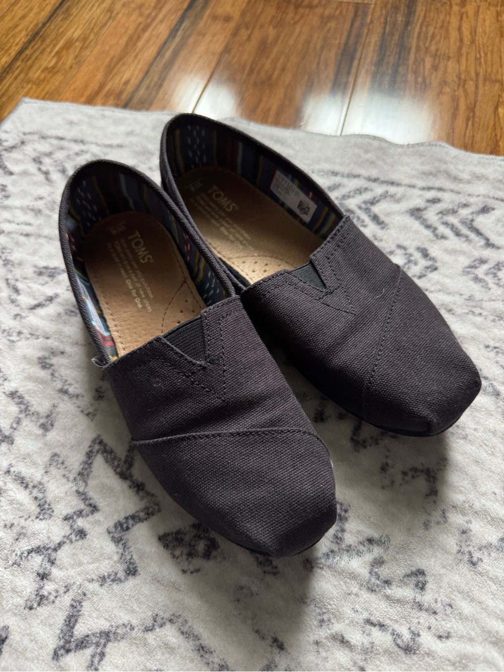 TOMS Black Canvas Slip-On Shoes with Patterned Lining